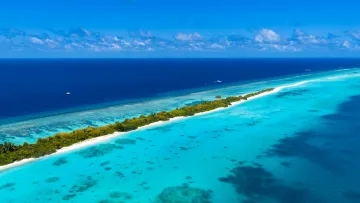 drone-shot, local-island, nature, sea - A stunning aerial view of Dhigurah local island, Alifu Dhaalu Atoll, surrounded by turquoise lagoon and deep ocean.