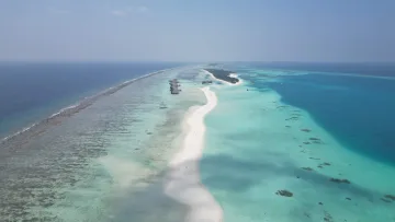 drone-shot, local-island, nature, resort, sea - Aerial view of the long white sandbank on Dhigurah local island, surrounded by turquoise lagoon and coral reef.