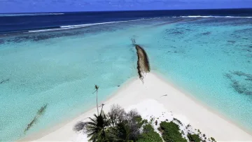 beach, drone-shot, local-island, sea - Aerial view of the pristine white sandbank in Feridhoo island, Alifu Alifu Atoll, surrounded by crystal clear lagoon.