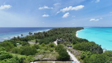 drone-shot, local-island, nature, sea - Aerial drone shot of the long and lush Fulhadhoo local island in Baa Atoll showing vegetation and turquoise lagoon