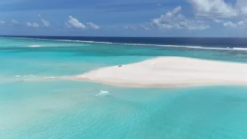 beach, drone-shot, sea - Aerial view of a pristine white sandbank in the turquoise lagoon of Fulhadhoo island, located in the Baa Atoll.