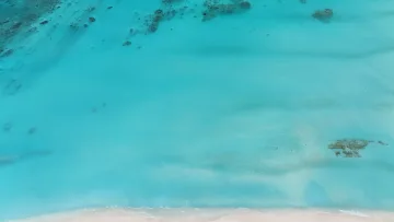 bikini-beach, drone-shot, local-island, sea - Aerial drone view of the turquoise lagoon and coral reefs off the coast of Fulhadhoo Island, Baa Atoll, Maldives.