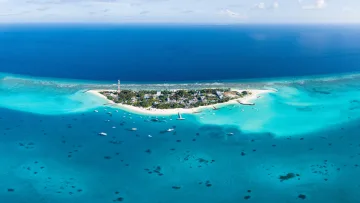 drone-shot, local-island, sea - Stunning aerial drone shot of Fulidhoo local island in Vaavu Atoll surrounded by vibrant turquoise reef lagoon water