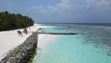beach, drone-shot, local-island - An aerial view of the white sandy beach and crystal clear lagoon of Fulidhoo Island in the beautiful Vaavu Atoll.