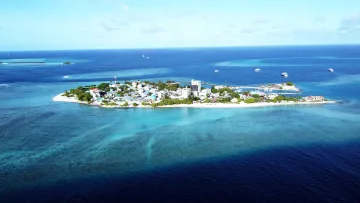 drone-shot, local-island, sea - Stunning drone view of the local island of Gulhi in South Male Atoll, featuring turquoise waters and white sandy beaches.