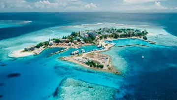 drone-shot, local-island, nature, sea - Breathtaking drone aerial shot of Gulhi local island in Kaafu Atoll surrounded by vibrant turquoise shallow water.