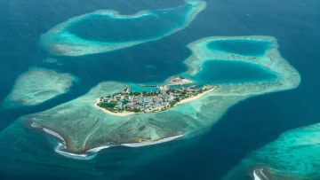 drone-shot, local-island, reef, sea - Stunning drone view of Gulhi local island in Kaafu Atoll, surrounded by crystal clear turquoise lagoons and reefs.