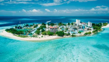 drone-shot, local-island, sea - Aerial perspective of the inhabited local island of Gulhi in Kaafu Atoll, featuring turquoise waters and beaches.
