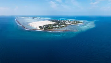 drone-shot, local-island, nature, sea - A stunning drone shot showing the local island of Hinmafushi in the Kaafu Atoll surrounded by vibrant blue ocean.