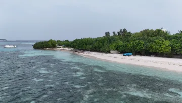 beach, local-island, sea - Aerial view of the white sandy beach on the local island of Hinmafushi, Kaafu Atoll, with turquoise lagoon water.