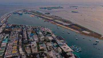 local-island, sunset - Aerial perspective of Hulhumalé local island, Kaafu Atoll, with its urban layout next to Velana International Airport