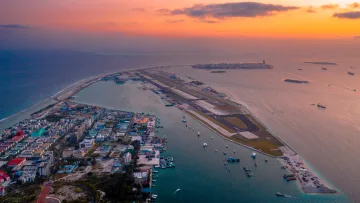 drone-shot, local-island, sunset - Stunning aerial sunset shot of Hulhumale local island and the main airport runway in Kaafu Atoll, Maldives.