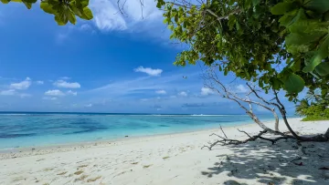 beach, local-island, nature, sea - A beautiful white sand beach on Hulhumale island, Kaafu Atoll, with a seaplane flying over the turquoise lagoon.