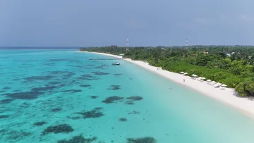 beach, bikini-beach, drone-shot, local-island, nature, sea - Stunning aerial drone view of the turquoise lagoon, white sandy beach, and lush vegetation of Kelaa Island, Haa Alifu Atoll.