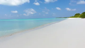beach, local-island - Wide empty white sand beach meeting crystal clear turquoise waters at Kelaa local island in Haa Alifu atoll