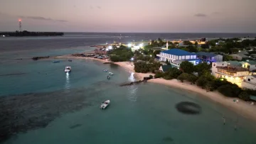 drone-shot, local-island, sunset - Drone view of Keyodhoo local island in Vaavu Atoll at sunset with boats anchored in the clear turquoise lagoon