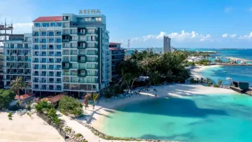 beach, bikini-beach, local-island - Aerial view of Arena Hotel situated on the sandy beach of Maafushi local island in the Kaafu Atoll, Maldives.