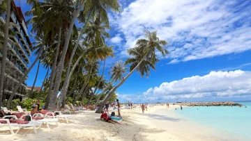 beach, bikini-beach, local-island, people, relax - Tourists relaxing under palm trees on the sunny Bikini Beach at Maafushi Island in the South Male Kaafu Atoll.