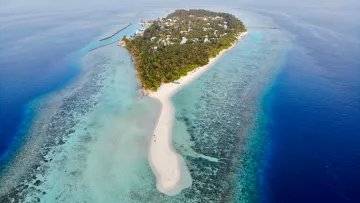 drone-shot, local-island, nature, sea - Aerial drone perspective of the tropical Omadhoo local island in Alifu Dhaalu Atoll surrounded by a shallow lagoon