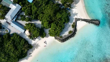 beach, bikini-beach, drone-shot, local-island, nature, sea - Aerial view of the lush Bikini Beach on Rasdhoo local island in Alifu Alifu Atoll with clear turquoise waters.