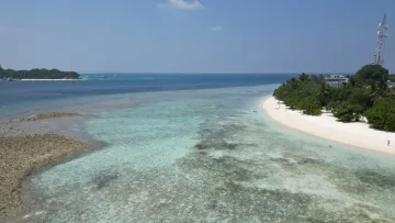 beach, drone-shot, local-island - Aerial view of Rasdhoo local island in Alifu Alifu Atoll, showcasing white sandy beaches and turquoise lagoon waters