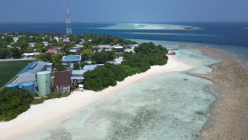 beach, drone-shot, local-island, nature, sea - Aerial view of Rasdhoo Island in Alifu Alifu Atoll, showcasing the local village, white sandy beach, and clear water.
