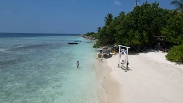 beach, bikini-beach, local-island, nature - Aerial view of Club Gabbiano beach on Rasdhoo local island in North Ari Atoll with turquoise water and boat.
