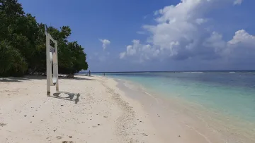 beach, bikini-beach, local-island - A white beach swing on the sandy bikini beach of Rasdhoo Island, Alifu Atoll, with turquoise water and blue sky.