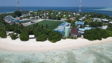 beach, drone-shot, local-island, nature - Drone shot of the local Rasdhoo island in Alifu Alifu atoll, featuring the central football field and lush greenery.
