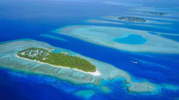 drone-shot, local-island, nature, reef, sea - Stunning aerial view showing Thinadhoo Island in Vaavu Atoll, surrounded by crystal turquoise lagoons and reefs.