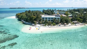 drone-shot, local-island, nature, sea - Drone perspective of Thinadhoo, a beautiful local island in Vaavu Atoll, showcasing the hotel, beach, and lagoon.