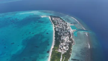 drone-shot, local-island, nature, sea - Aerial perspective of Vashafaru local island in Haa Alifu Atoll, showcasing turquoise lagoon, sandy beach and harbor.