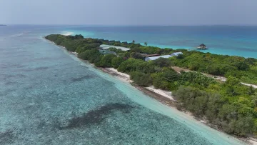 drone-shot, local-island, nature - Aerial drone shot of Vashafaru local island in Haa Alifu Atoll, showing lush tropical vegetation, white sandy beaches and turquoise waters.