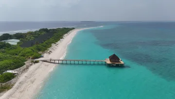 drone-shot, local-island, sea - Stunning aerial drone shot of the wooden jetty on Vashafaru local island, Haa Alifu Atoll, surrounded by turquoise sea