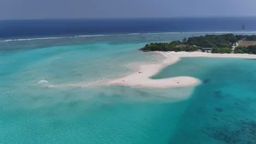 drone-shot, local-island, nature, sea - Aerial view of the white sandbank on Vashafaru local island, Haa Alifu Atoll, surrounded by crystal clear lagoon waters.