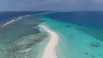 drone-shot, local-island, nature, sea - An aerial drone view showing the long pristine white sandbank of Vashafaru island in Haa Alifu Atoll with turquoise sea