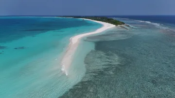 beach, drone-shot, local-island, nature, sea - Aerial view of the long white sandbank leading to Vashafaru local island in Haa Alifu Atoll with turquoise ocean.